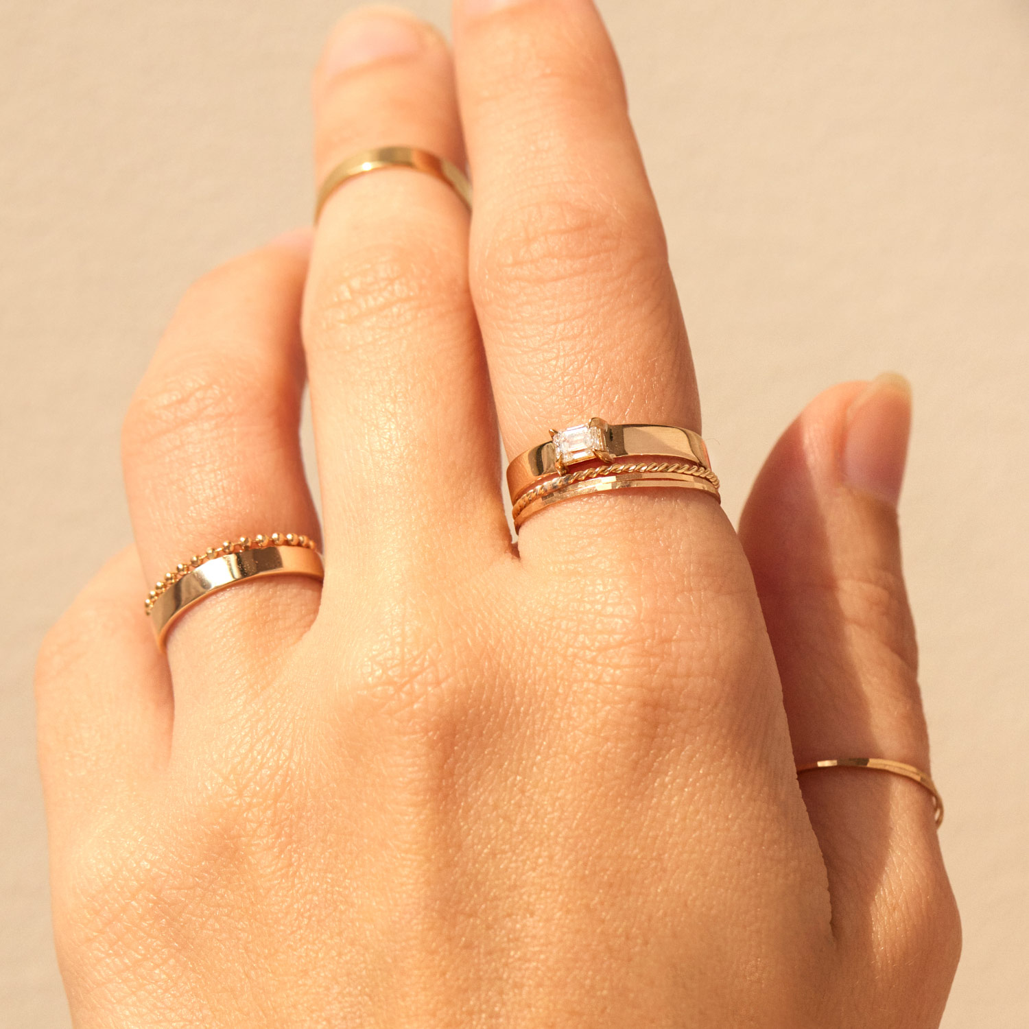 1150-emerald-cut-diamond-tomboy-ring–1.jpg